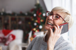 Smiling senior woman on the phone during the holidays